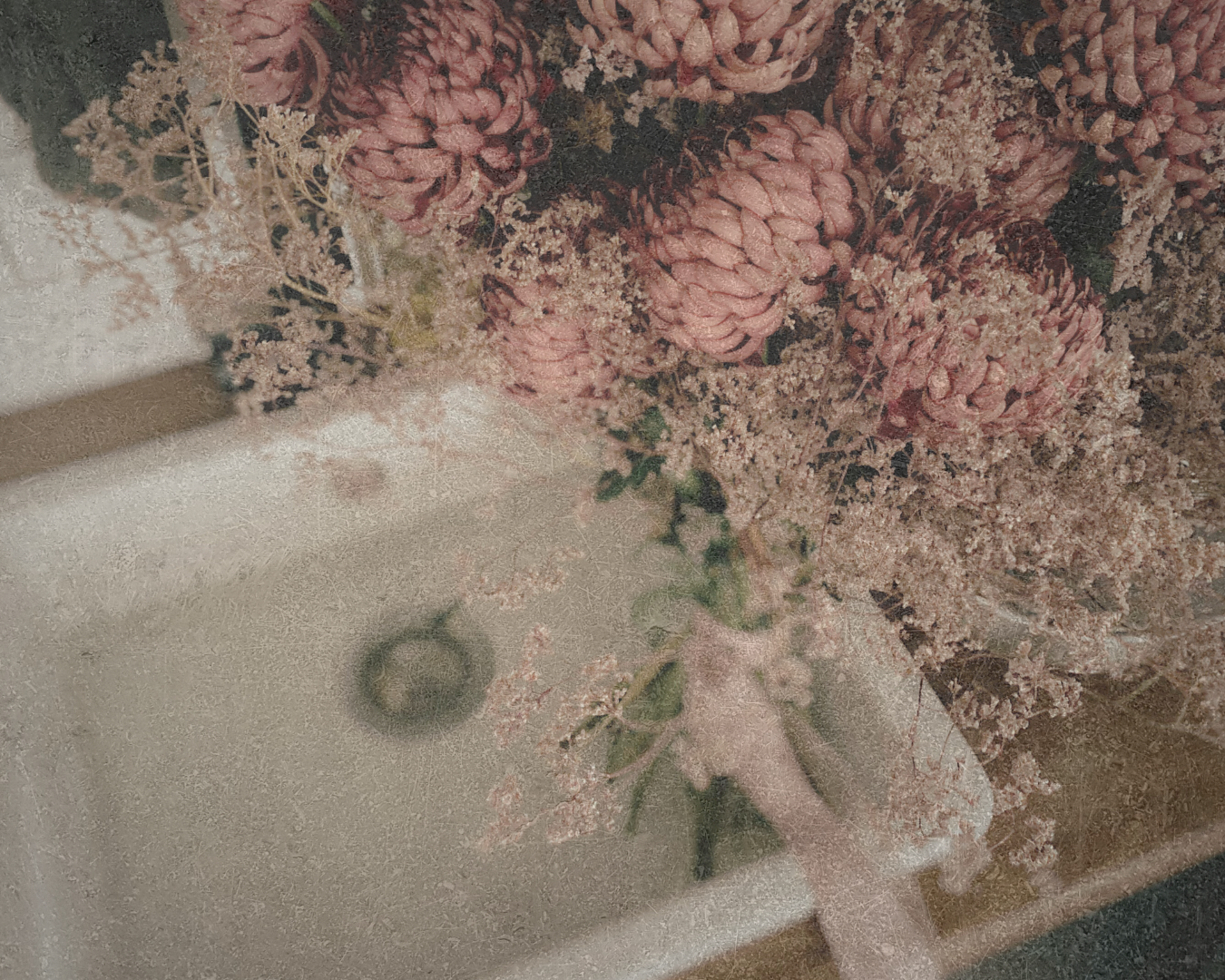 Bouquet of pink flowers in a white sink with a blurred background